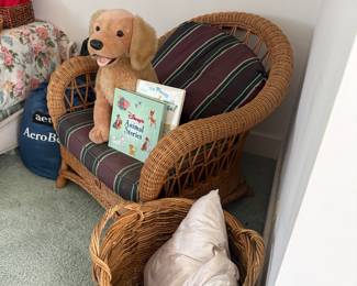 Wicker armchair with plush dog and children's book