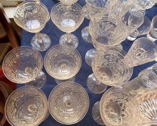 Cut crystal champagne coupes and wine glasses