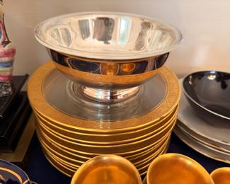 Silver bowl and gold encrusted dinner plates