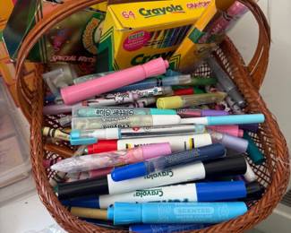 Basket of Crayola markers and art supplies
