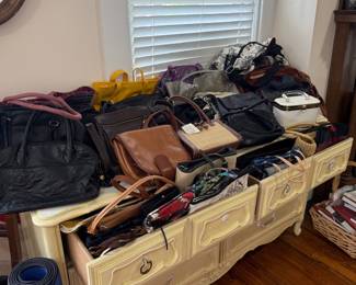 Antique wood valet stand with handbags