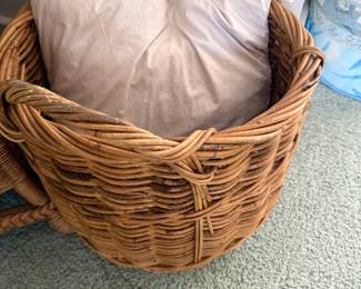 Large woven wicker basket with pillows