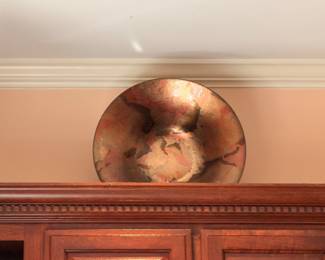 Large copper charger plate wall display