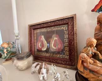 Framed pear still life with Hummel and glass figurines