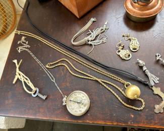 Gold tone chains, pocket watch and pendants