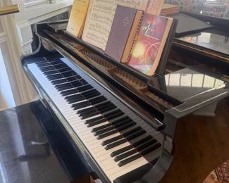 Kawai baby grand piano with sheet music