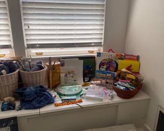 Craft room with yarn baskets and supplies