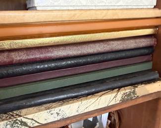 Stack of vintage yearbooks and albums