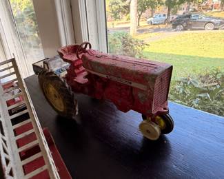 Vintage red toy farm tractor