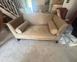 . . . neutral-colored upholstered love seat