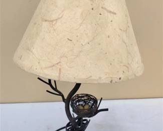 A newer small table lamp in the form of a nest