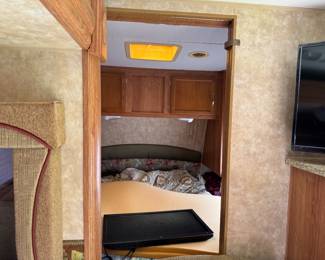 View of front Queen bedroom, has privacy door & TV