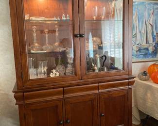 Lighted china cabinet with lined drawers