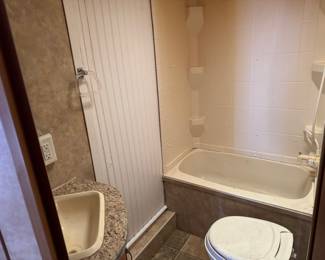 Full bathroom with bathtub-shower combo