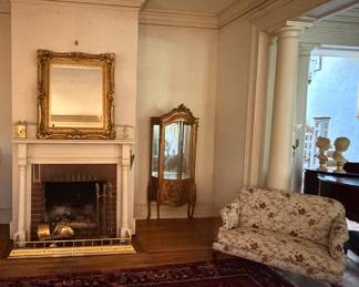 French style vitrine cabinet, brass fire fender, mirror, rug, settee