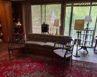 Rug, pair of reeded, cane bottom chairs, rug, lamps, side tables, spinning bookcase