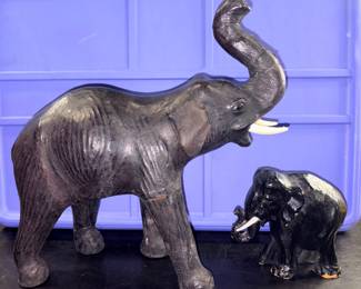 One leather and one wooden elephant, perfect for the Alabama fan