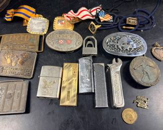Collection of lighters belt buckles, silver, and more