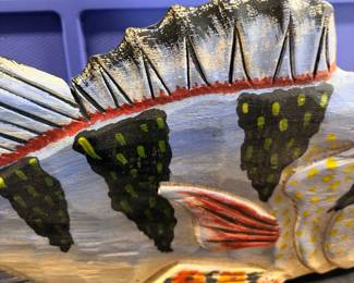 Collection of folk art fish. They are hand carved and hand painted.
