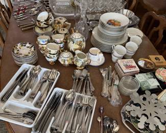Fine china, formal silverware, crystal