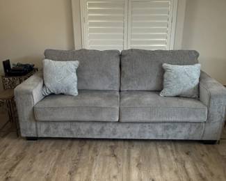 Gray Upholstered Sofa with Accent Pillows