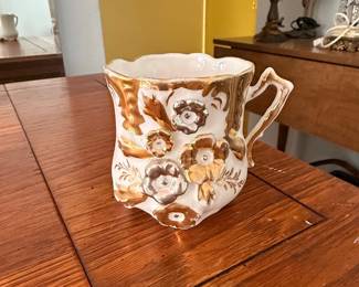 Victorian Porcelain Mustache Cup with Applied Floral Motifs and Gold Gilding
