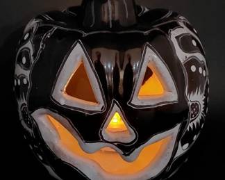 There are 2 pottery jack o lanterns in this sale and lots of other vintage Halloween items, decorations, masks, etc. 