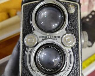 Huge lots of cameras and equipment.  This is a Rolleiflex, there are lots of other brands. 