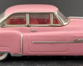 1950 Cadillac - pink tin friction made by Luxe Toys. 