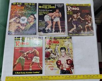 old RING boxing magazines dating to 1950s Cassius Clay (Mohammed Ali), Joe Frazier, George Foreman, lots of other boxers featured.  There are several lots of these. 