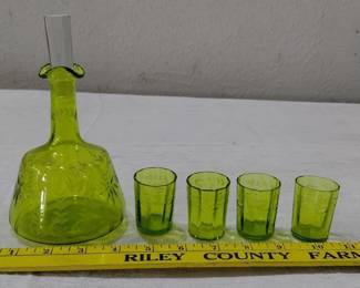 Green glass antique drinking set.  We think it is Baccarat