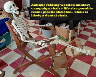 Antique folding military campaign dentist or medical chair.  Plust a life size resin skeleton / halloween decoration. 