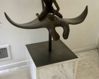Bronze Boy riding a sweeping Manta RaySculpture