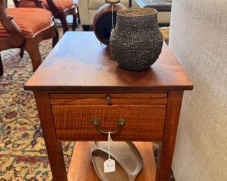 Artisan crafted koa wood side table and vintage ceramics.