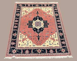 Geometric Medallion Area Rug – A bold central medallion surrounded by warm coral, navy, cream, and decorative geometric details.