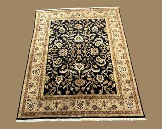 Black and Ivory Floral Area Rug – A dramatic dark field surrounded by an ornate cream and gold floral border.