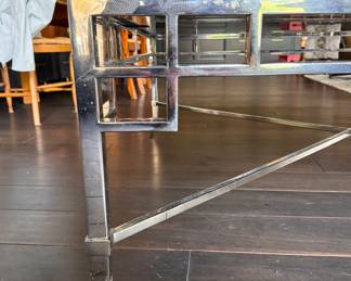 Chrome and Smoked Mirrored Glass Cocktail Table with Lacquered Ebony Raised Edge Trim. Measures 48" x 48" x 20" H. Photo 2 of 4. 