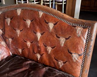 Spanish Colonial Style Leather Upholstered Sofa with Heavily Distresses Patinated Leather Seat, Turned Wood Frame with Hair on Hide Surround. Measures 80" W x 40" D. Photo 2 of  4. 