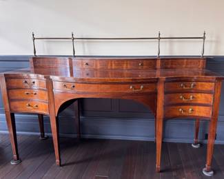 Baker Furniture Mahogany Serpentine Front Sideboard with Stepback Drawer and Brass Gallery. Measures 78" W x 29" D x 38" H In Front & 52" H in Back. Photo 1 of 7. 