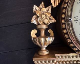 Gustavian Style Giltwood Wall Clock with Ribbon Crest. Measures 24" x 14" x 4" D. Photo 2 of 2. 
