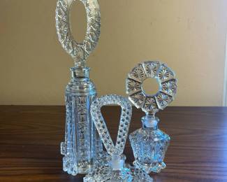 p Cut Glass Perfume Bottles with Intricate Stoppers and Distinct Sizes H 11.5in, 7in, and 5.5in