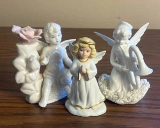 k Set of Three Angel and Fairy Figurines with Floral and Musical Details