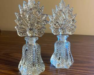 p Pair of Intricately Cut Crystal Perfume Bottles with LeafShaped Stoppers H 7in