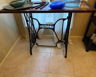 table with iron Singer treadle base