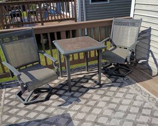 Outdoor table with pair swivel chairs