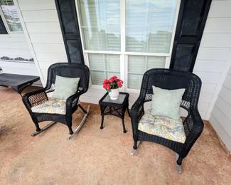 Black rattan outdoor chairs, table