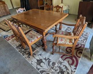 Antique dining table with six chairs