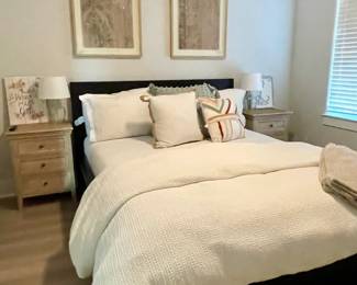 night stands, black bed and mattress, table lamps
