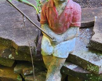 Weathered concrete garden statue of a boy