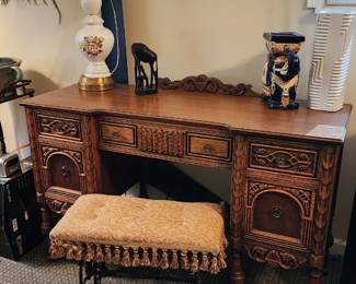 Antique Jacobean desk with intricate carved panels
